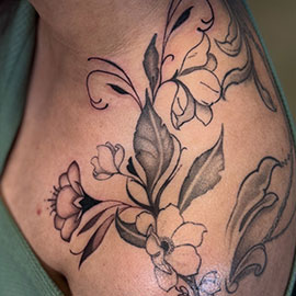 Custom delicate flowers on shoulder, blackwork fineline design by sheila.tattoos Lights Out Tattoo Santa Cruz CA
